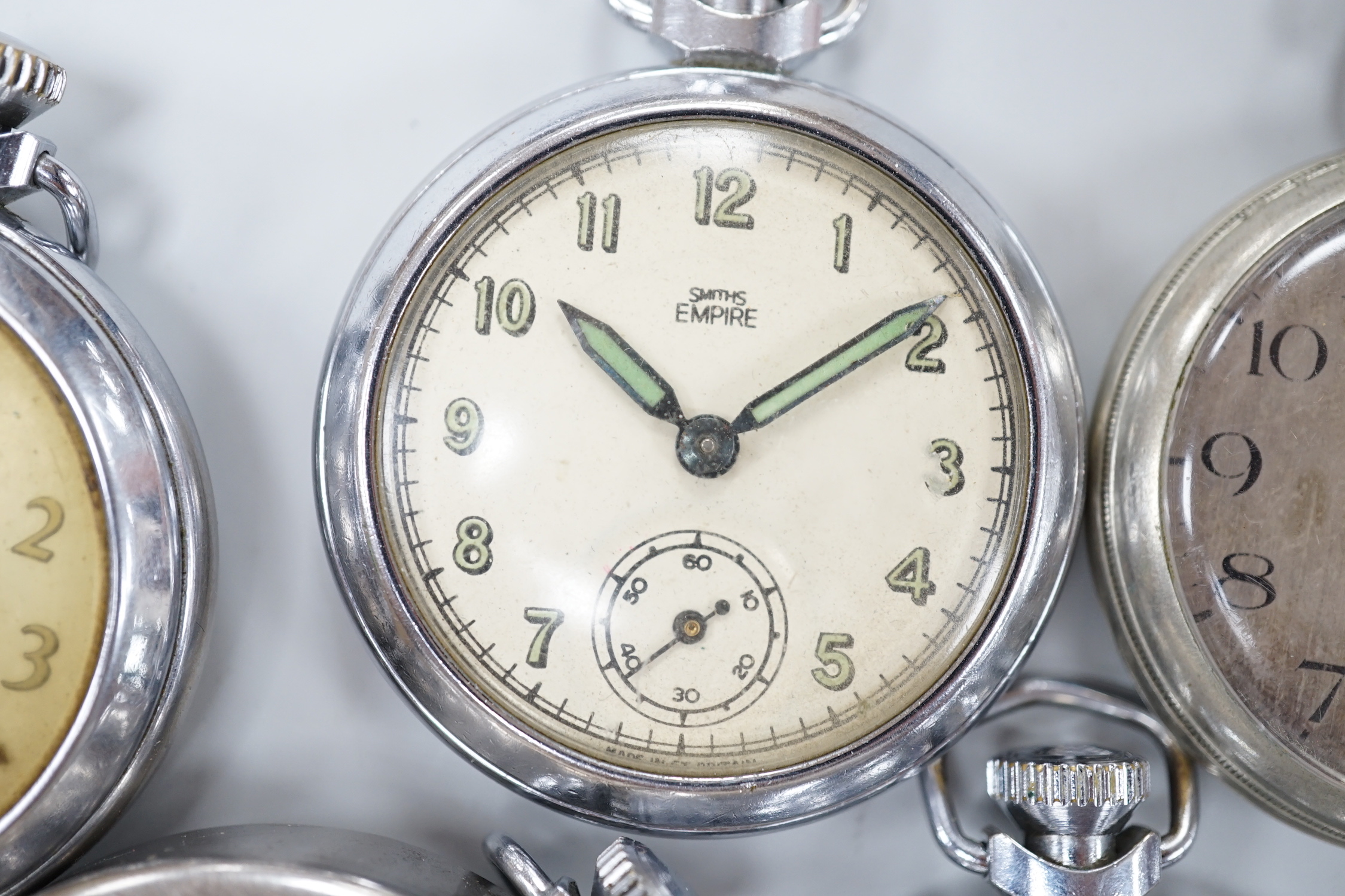 Ten assorted base metal pocket watches including Ingersoll football related, Smiths and Smiths Empire etc.